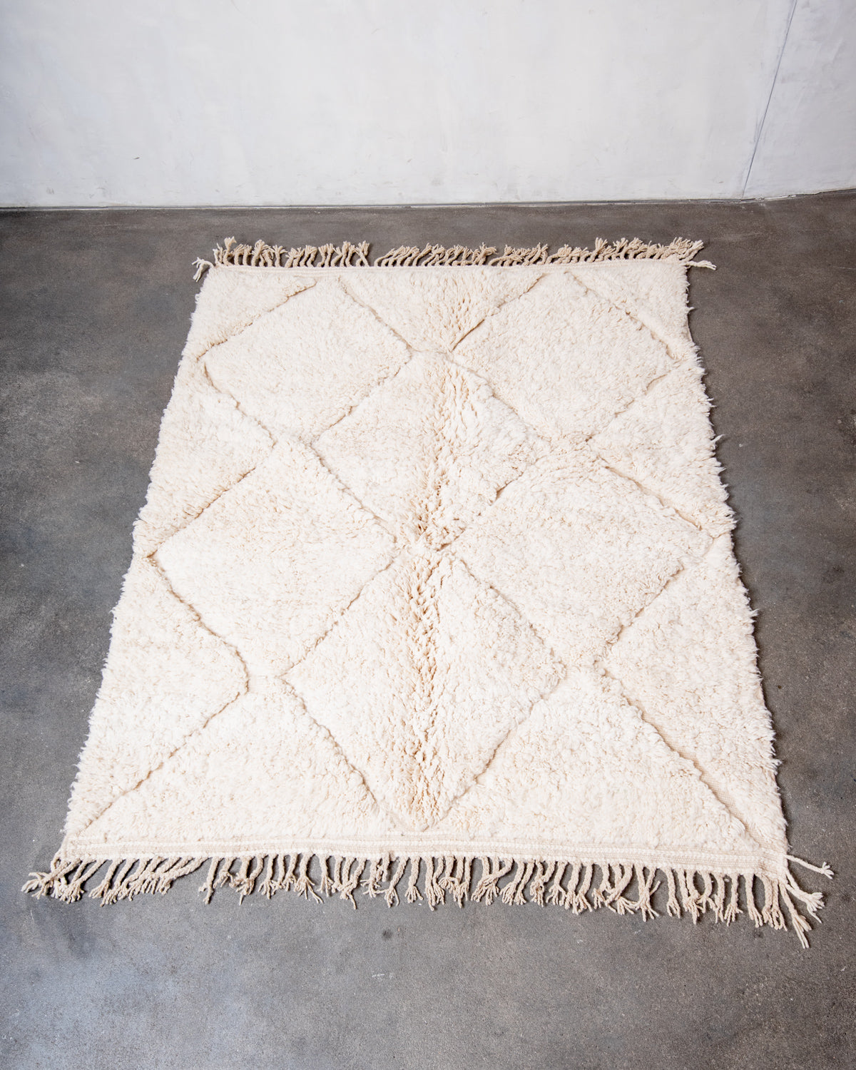 Modern, designer, handcrafted Berber rug from Morocco. Beniourain carpet with minimalist design, natural wool pile and a fluffy texture.